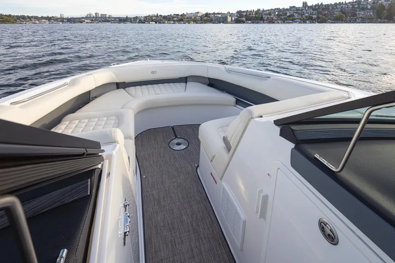 Slide: The Image of 2018 Cobalt 30 R boat interior with spacious seating on a calm lake. - 27