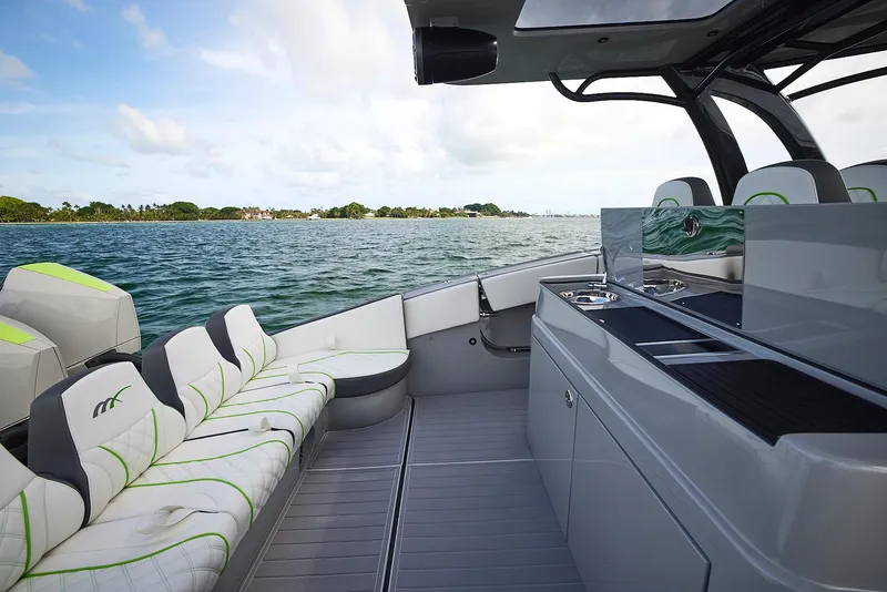 Slide: The Image of Luxurious 2022 Midnight Express 43' Solstice yacht interior with seating and ocean view. - 19