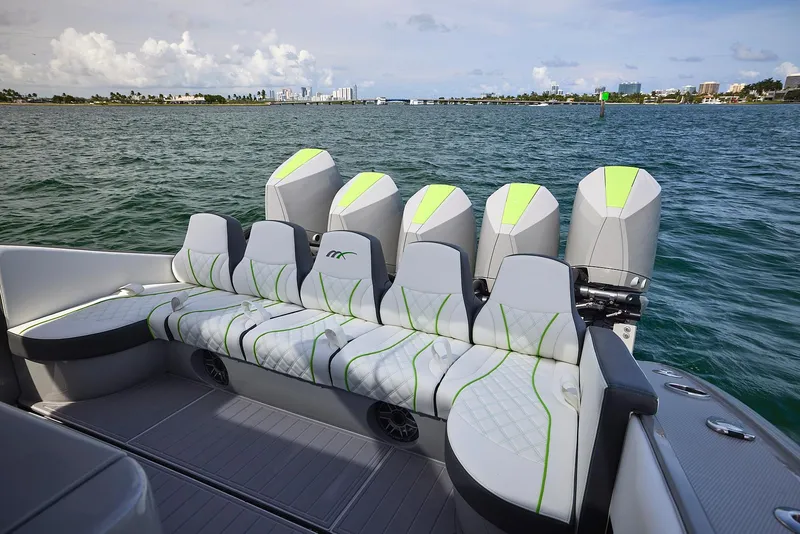 Slide: The Image of 2022 Midnight Express 43' Solstice boat with stylish seating and powerful engines on the water. - 24