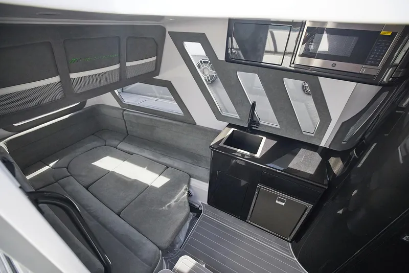 Slide: The Image of Luxurious interior of 2022 Midnight Express 43' Solstice yacht with modern seating and kitchenette. - 25