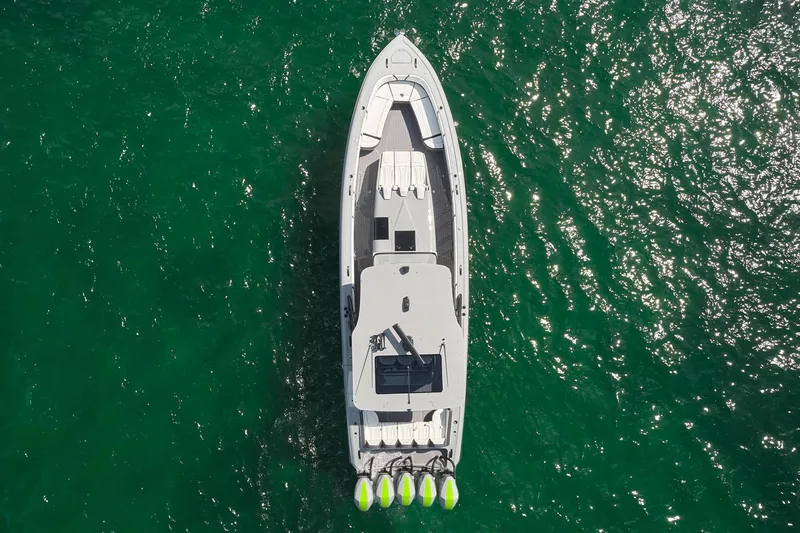 Slide: The Image of Aerial view of 2022 Midnight Express 43' Solstice boat on green water. - 6