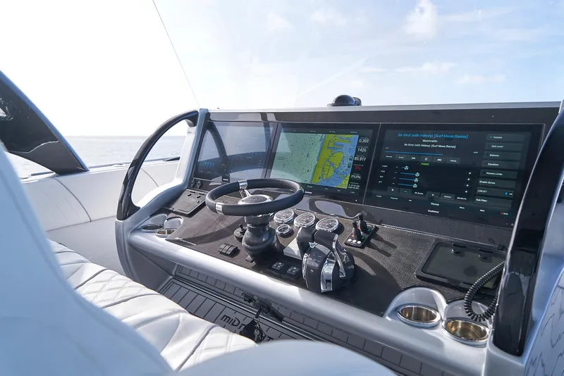 Slide: The Image of Midnight Express 43' Open 2021 boat dashboard with advanced navigation system and controls. - 13