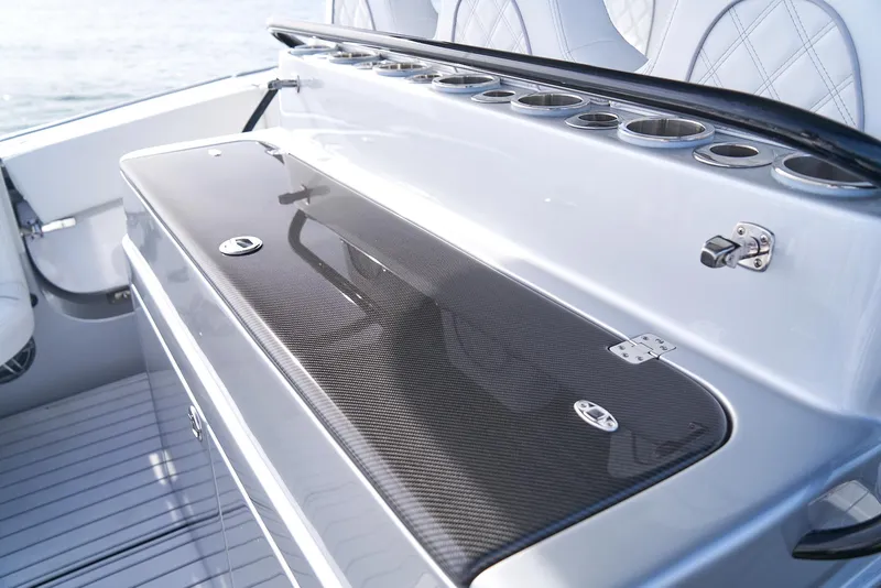 Slide: The Image of 2021 Midnight Express 43' Open boat interior with sleek carbon fiber details. - 16