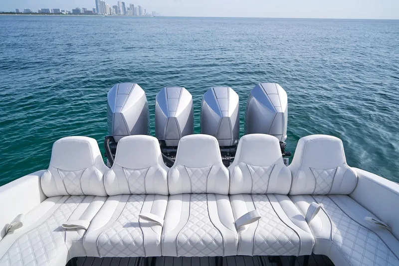 Slide: The Image of 2021 Midnight Express 43' Open boat with five outboard engines on open water. - 22