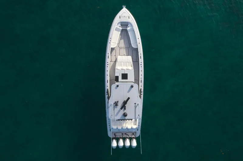 Slide: The Image of Aerial view of a 2021 Midnight Express 43' Open boat on clear water. - 3