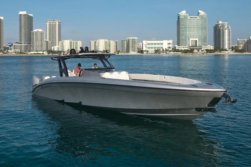 Slide: The Image of 2021 Midnight Express 43' Open boat on water with city skyline background. - 4