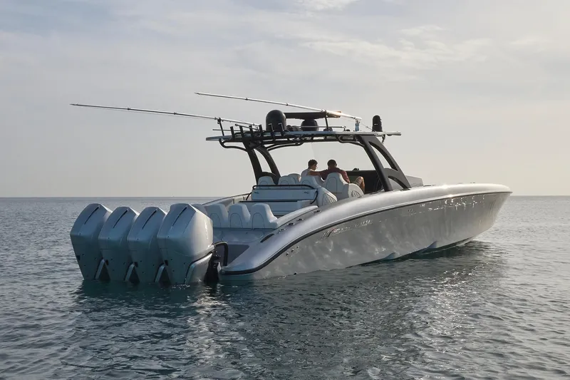 Slide: The Image of 2021 Midnight Express 43' Open boat with multiple outboard engines on calm water. - 7