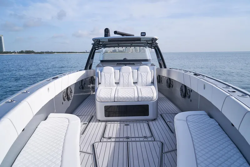 Slide: The Image of 2021 Midnight Express 43' Open boat with luxurious seating on calm waters. - 8