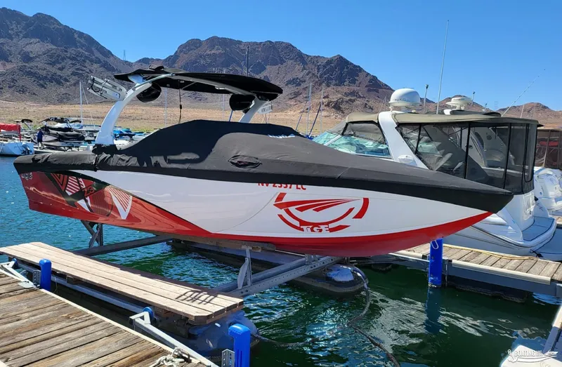 Slide: The Image of 2016 Tigé Z3 boat docked at marina with scenic mountain backdrop. - 11
