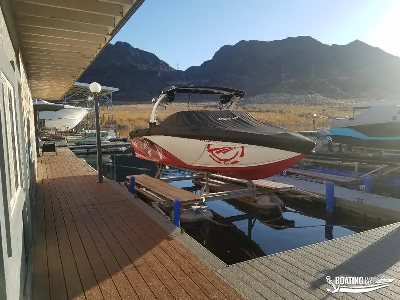 Slide: The Image of 2016 Tigé Z3 boat docked at marina with mountain backdrop. - 5