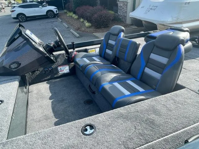 Slide: The Image of 2024 Ranger RT178C boat interior with gray and blue seats. - 4