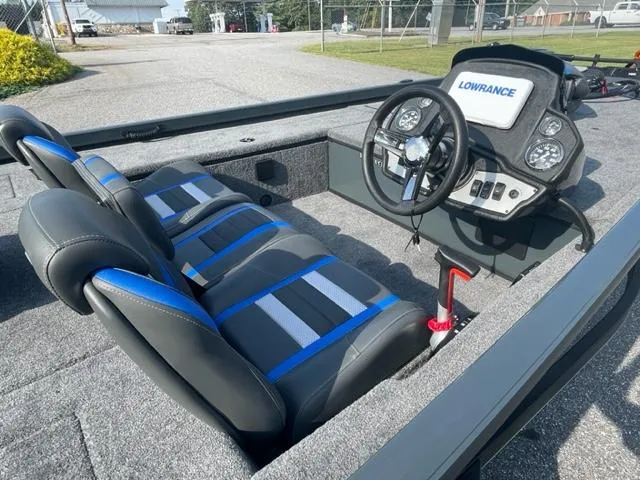 Slide: The Image of 2024 Ranger RT178C boat interior with steering console and three seats. - 6