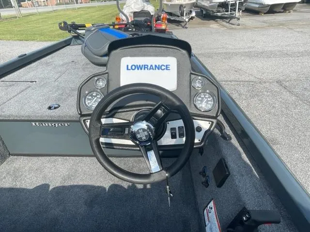 Slide: The Image of 2024 Ranger RT178C boat dashboard with Lowrance electronics and steering wheel. - 7