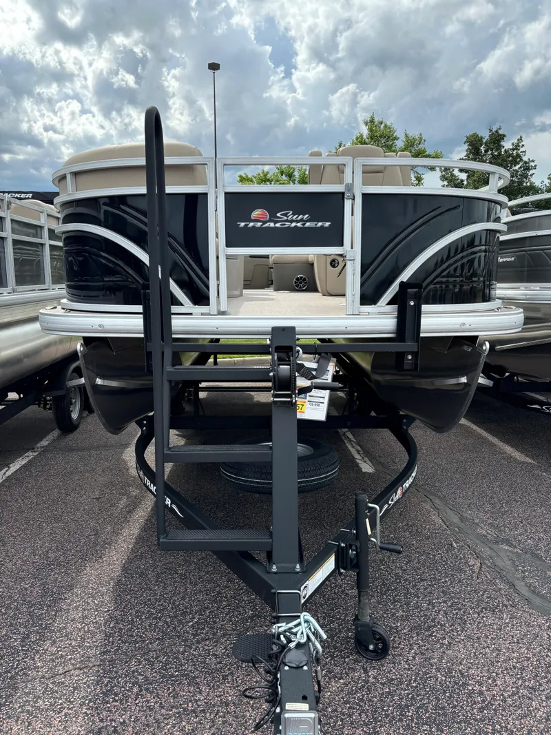 Slide: The Image of 2024 Sun Tracker SportFish 20 DLX pontoon boat on trailer. - 2