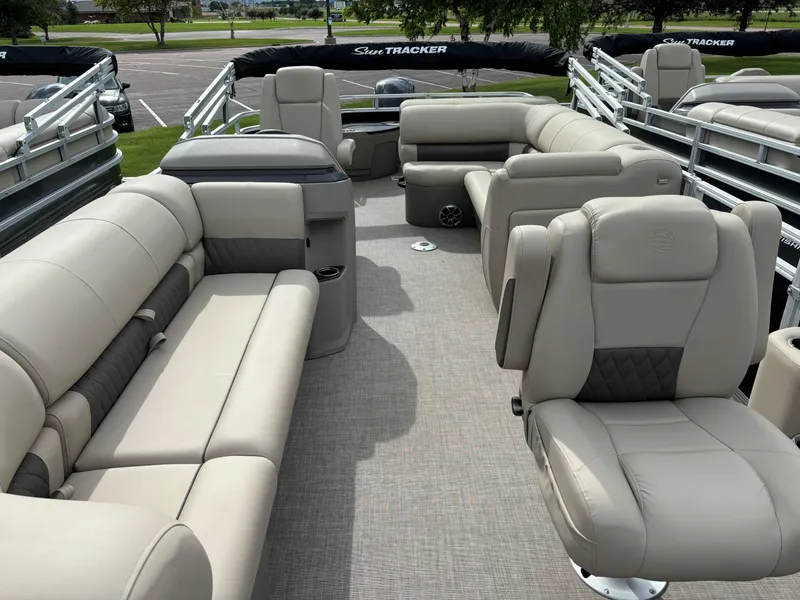 Slide: The Image of 2024 Sun Tracker SportFish 20 DLX pontoon boat with spacious seating and modern design. - 7