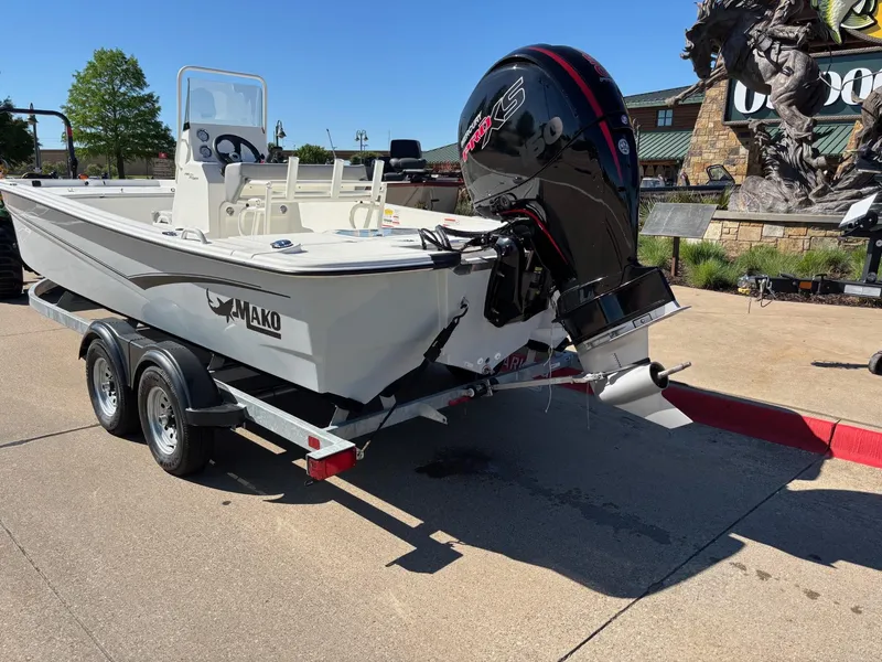 Slide: The Image of 2024 Mako Pro Skiff 19 CC boat on trailer, outdoor display. - 2