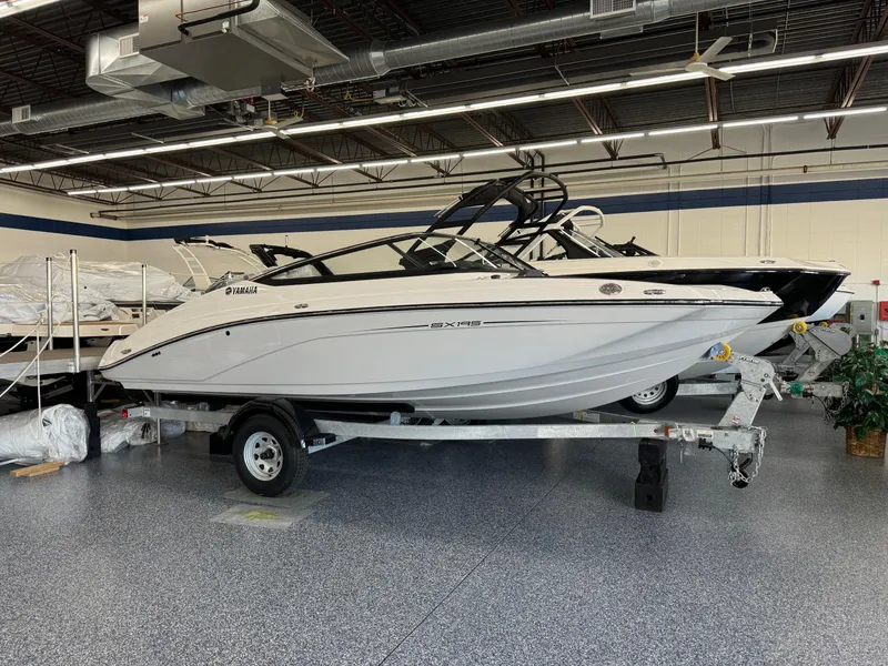 Slide: The Image of 2024 Yamaha Boats SX195 on trailer in showroom. - 0