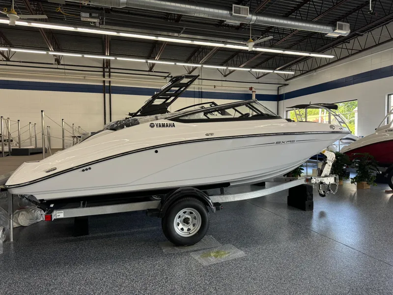 Slide: The Image of 2024 Yamaha Boats SX195 on trailer in showroom. - 1