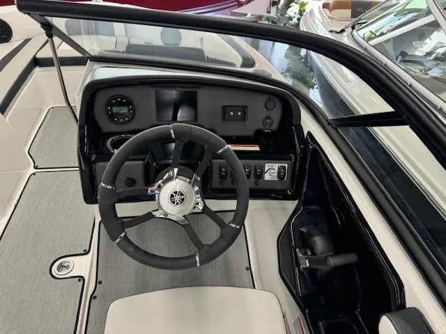 Slide: The Image of 2024 Yamaha Boats SX195 dashboard and steering wheel, showcasing modern controls and sleek design. - 11