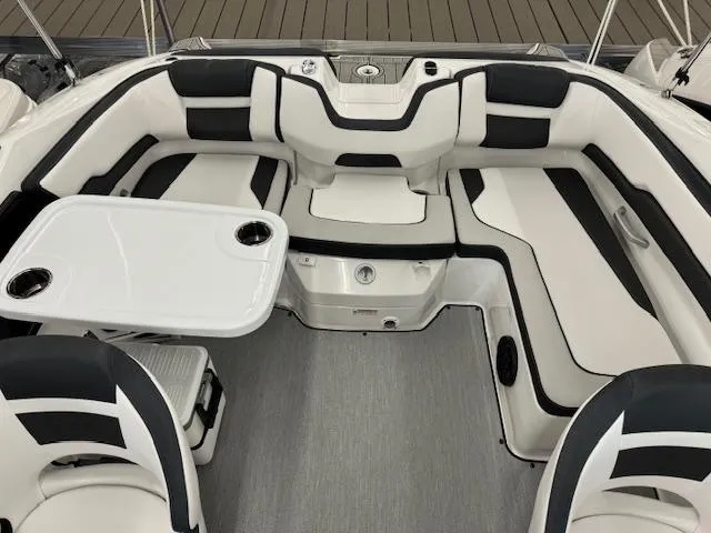 Slide: The Image of 2024 Yamaha Boats SX195 interior seating and table setup. - 13