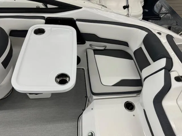 Slide: The Image of 2024 Yamaha Boats SX195 interior seating and table setup. - 17
