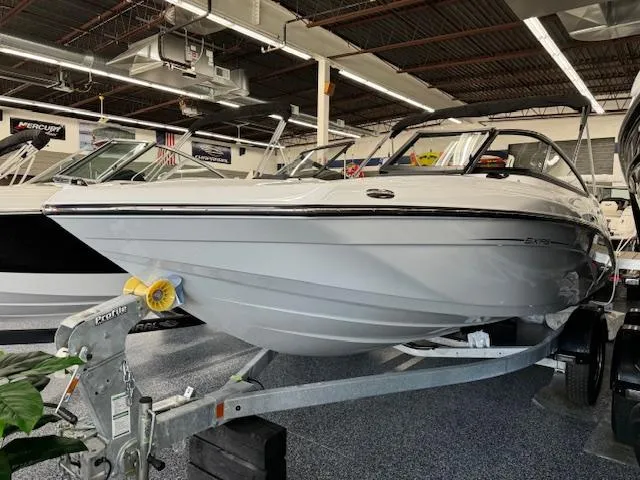 Slide: The Image of 2024 Yamaha Boats SX195 on trailer in showroom. - 4