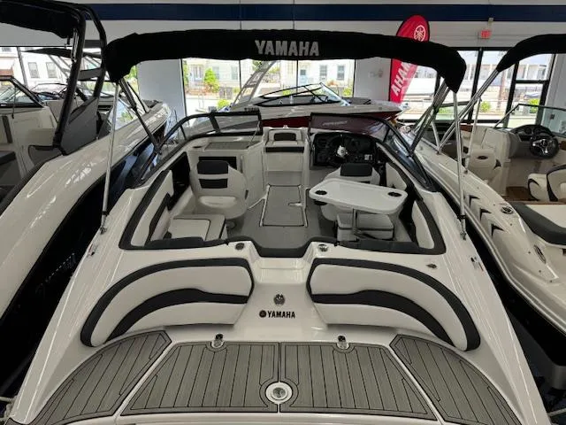 Slide: The Image of 2024 Yamaha Boats SX195 interior view with seating and steering console. - 6