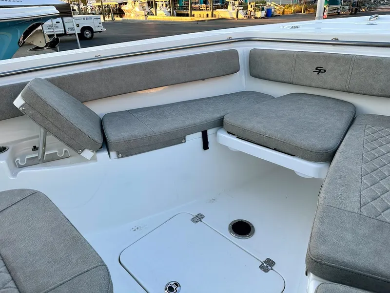 Slide: The Image of 2024 Sea Pro 222 boat interior with gray cushioned seating. - 4