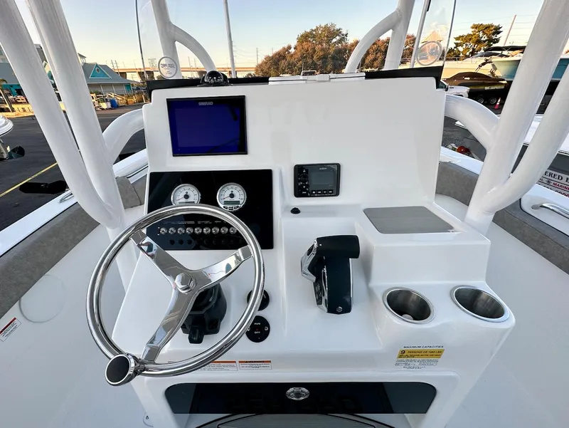 Slide: The Image of 2024 Sea Pro 222 boat console with steering wheel, gauges, and electronic displays. - 5
