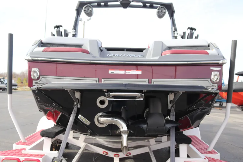 Slide: The Image of 2024 Nautique GS22 boat rear view on trailer. - 9