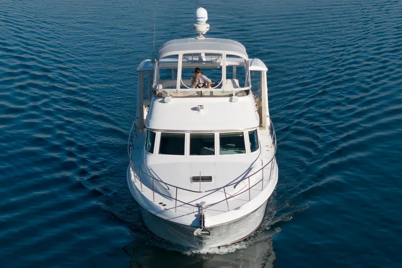 Slide: The Image of 1997 Sea Ray 420 Aft Cabin yacht cruising on calm waters. - 10