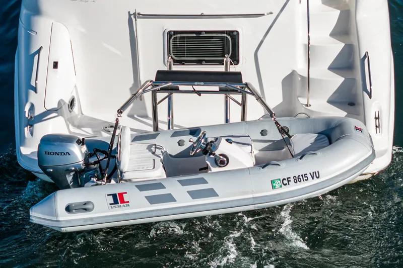 Slide: The Image of 1997 Sea Ray 420 Aft Cabin with inflatable dinghy and Honda outboard motor. - 14