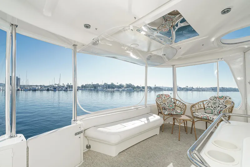 Slide: The Image of 1997 Sea Ray 420 Aft Cabin interior with waterfront view. - 17