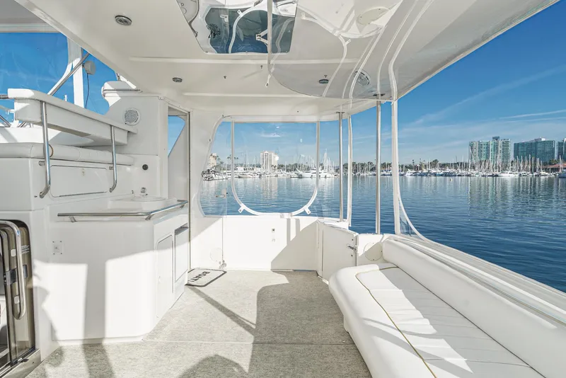 Slide: The Image of 1997 Sea Ray 420 Aft Cabin interior with marina view. - 19