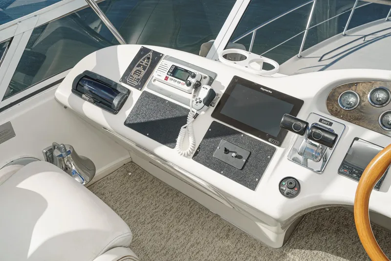Slide: The Image of Helm station of a 1997 Sea Ray 420 Aft Cabin yacht with navigation equipment. - 27