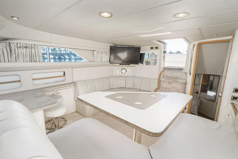 Slide: The Image of Luxurious interior of a 1997 Sea Ray 420 Aft Cabin yacht with modern amenities. - 36