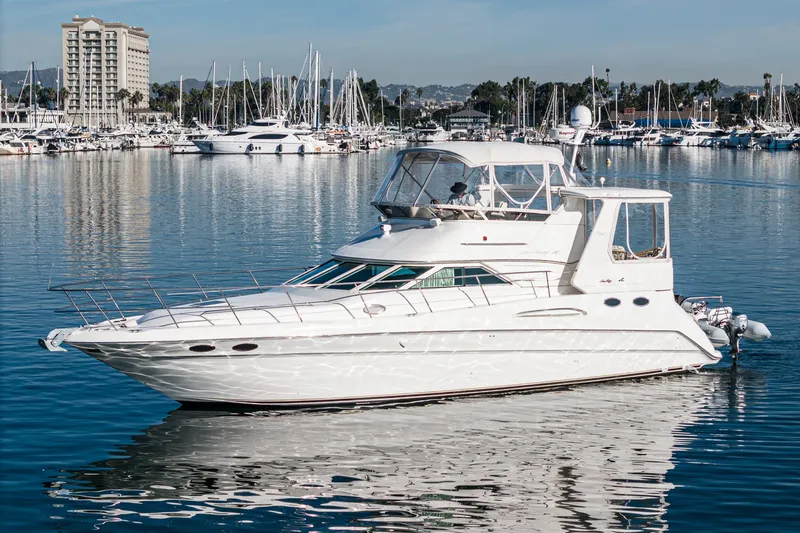 Slide: The Image of 1997 Sea Ray 420 Aft Cabin yacht docked in a marina. - 7