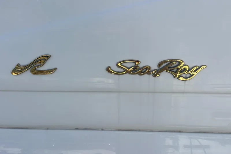 Slide: The Image of Gold Sea Ray logo on a 1997 Sea Ray 420 Aft Cabin yacht. - 72