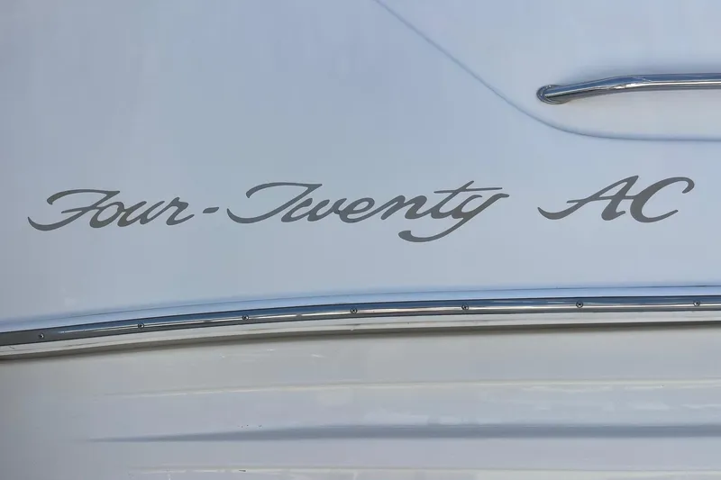 Slide: The Image of "Four-Twenty AC" script on 1997 Sea Ray 420 Aft Cabin yacht exterior. - 73
