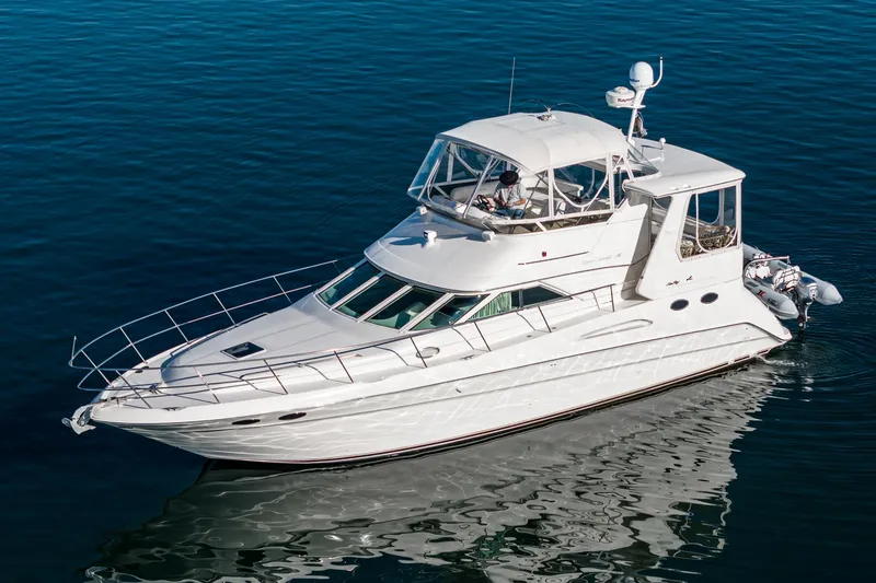 Slide: The Image of 1997 Sea Ray 420 Aft Cabin yacht cruising on calm waters. - 8