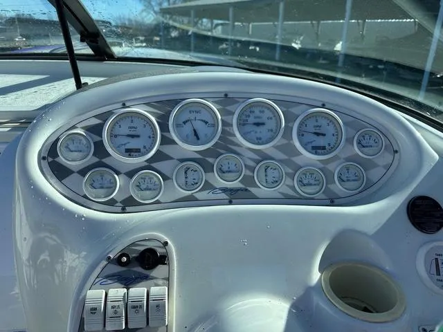 Slide: The Image of 1997 Baja Boss 302 speedboat on a trailer, covered with a protective tarp. - 10