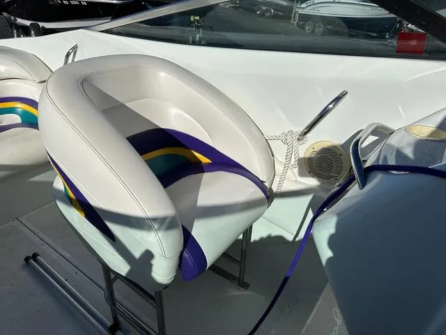 Slide: The Image of 1997 Baja Boss 302 boat dashboard with steering wheel and gauges. - 12