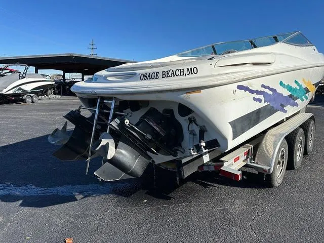 Slide: The Image of Close-up of a 1997 Baja Boss 302 boat hull with colorful graphics. - 3