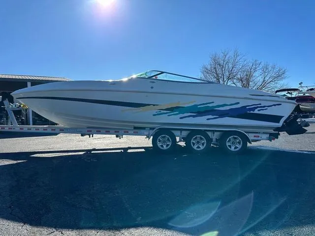 Slide: The Image of 1997 Baja Boss 302 boat on a trailer at Osage Beach, MO. - 5