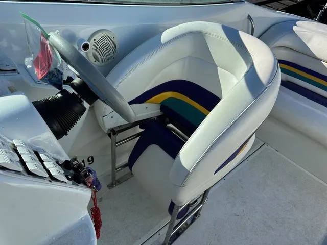 Slide: The Image of Close-up of a 1997 Baja Boss 302 boat's bow under a clear blue sky. - 9