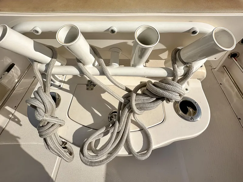Slide: The Image of 2017 Robalo R222 boat with rod holders and coiled ropes. - 11