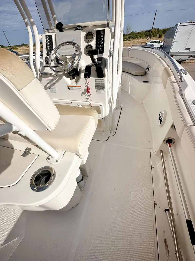 Slide: The Image of 2017 Robalo R222 boat interior with helm and seating. - 12