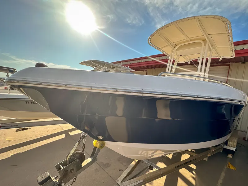 Slide: The Image of 2017 Robalo R222 boat on trailer under sunny sky. - 3