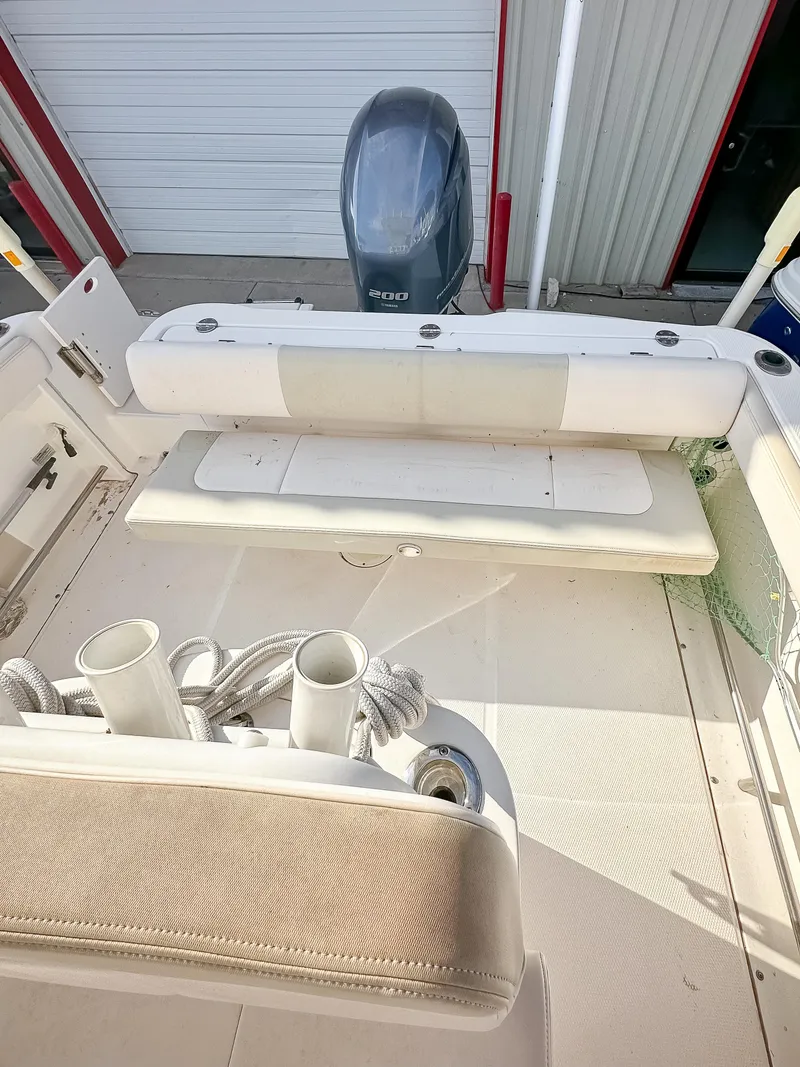 Slide: The Image of 2017 Robalo R222 boat interior with outboard motor. - 8