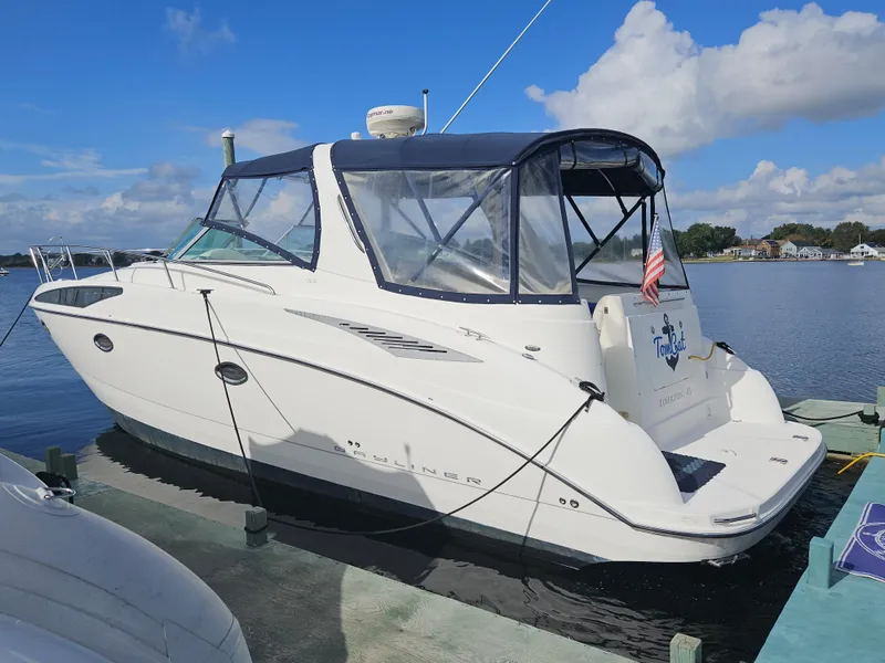 The Image of 2006 Bayliner 325 boat docked on a sunny day with clear skies. - 0